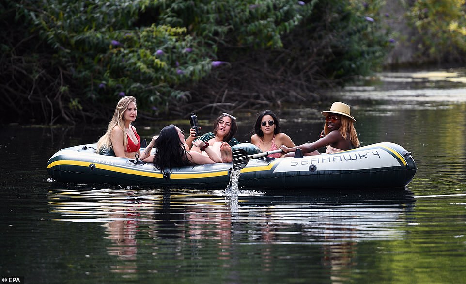 30096806-8464983-A_group_of_women_enjoyed_relaxing_in_a_large_dinghy_at_a_canal_i-a-112_1593212880639.jpg