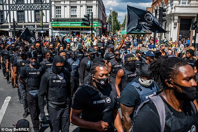 31447978-8585073-Activists_block_Brixton_Road_as_they_march_through_London_s_stre-a-5_1596361815444.jpg