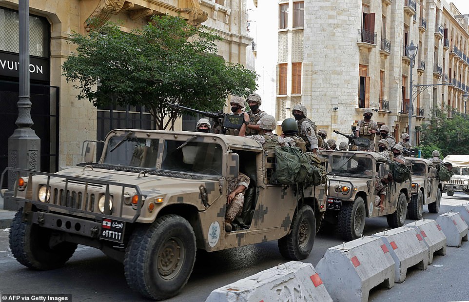 31715362-8607361-Lebanese_army_soldiers_arrive_to_downtown_Beirut_on_August_8_202-a-44_1596900772253.jpg