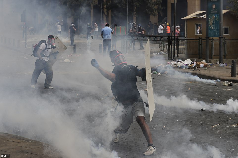 31715364-8607361-People_clash_with_police_during_a_protest_against_the_political_-a-39_1596900772233.jpg