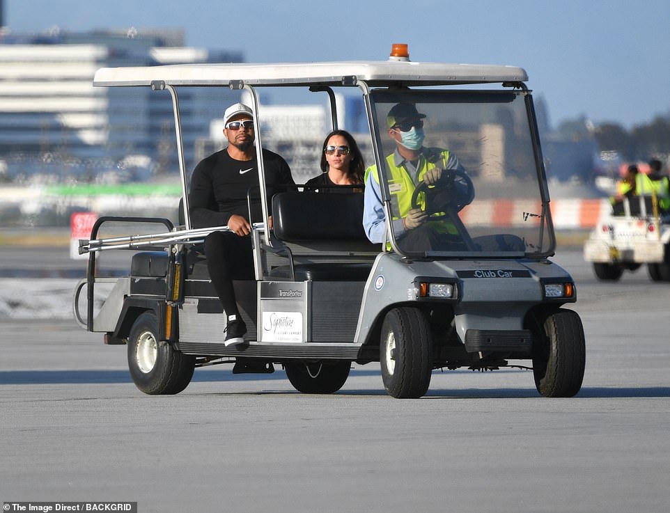 44261283-9689455-On_the_tarmac_the_sports_icon_struggled_to_get_into_a_golf_cart_-m-71_1623780117856.jpg