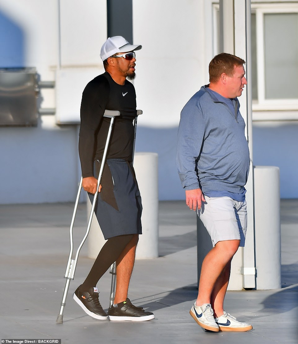 44261295-9689455-Tiger_Woods_has_been_pictured_out_for_the_first_time_since_shatt-a-50_1623780022550.jpg