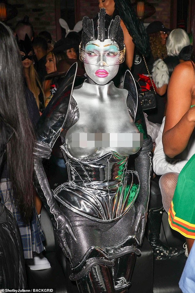 64000857-11370777-Body_armor_The_elaborate_costume_featured_silver_body_armor_from-a-6_1667162562628.jpg