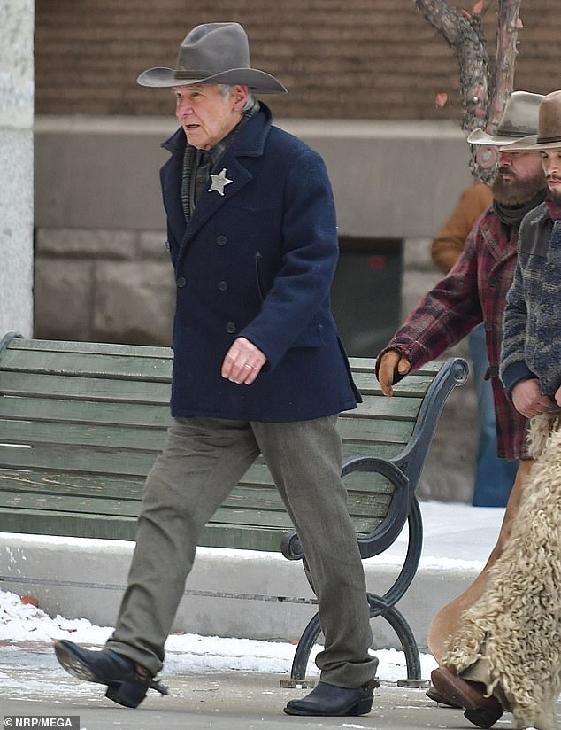 92253135-14102439-Ford_bundled_up_wearing_a_double_breasted_dark_blue_coat_that_wa-a-121_1732048840946.jpg