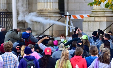 Police officers spray protesters shortly after a moment of silence during a get-out-the-vote march in Graham, North Carolina, on Saturday.