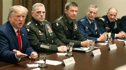 US President Donald Trump receives a briefing from military leaders at the White House on 7 October 2019