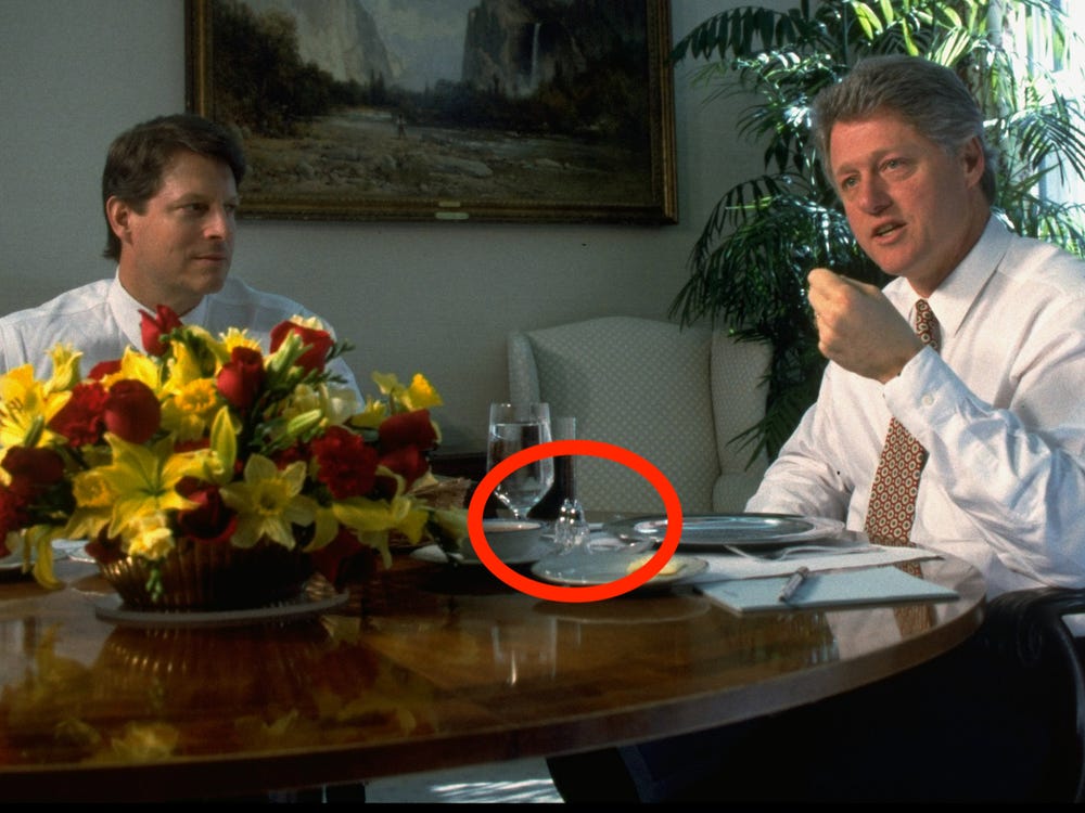 Pres. Bill Clinton answering reporter's query while having lunch w. VP Al Gore (L) at WH.
