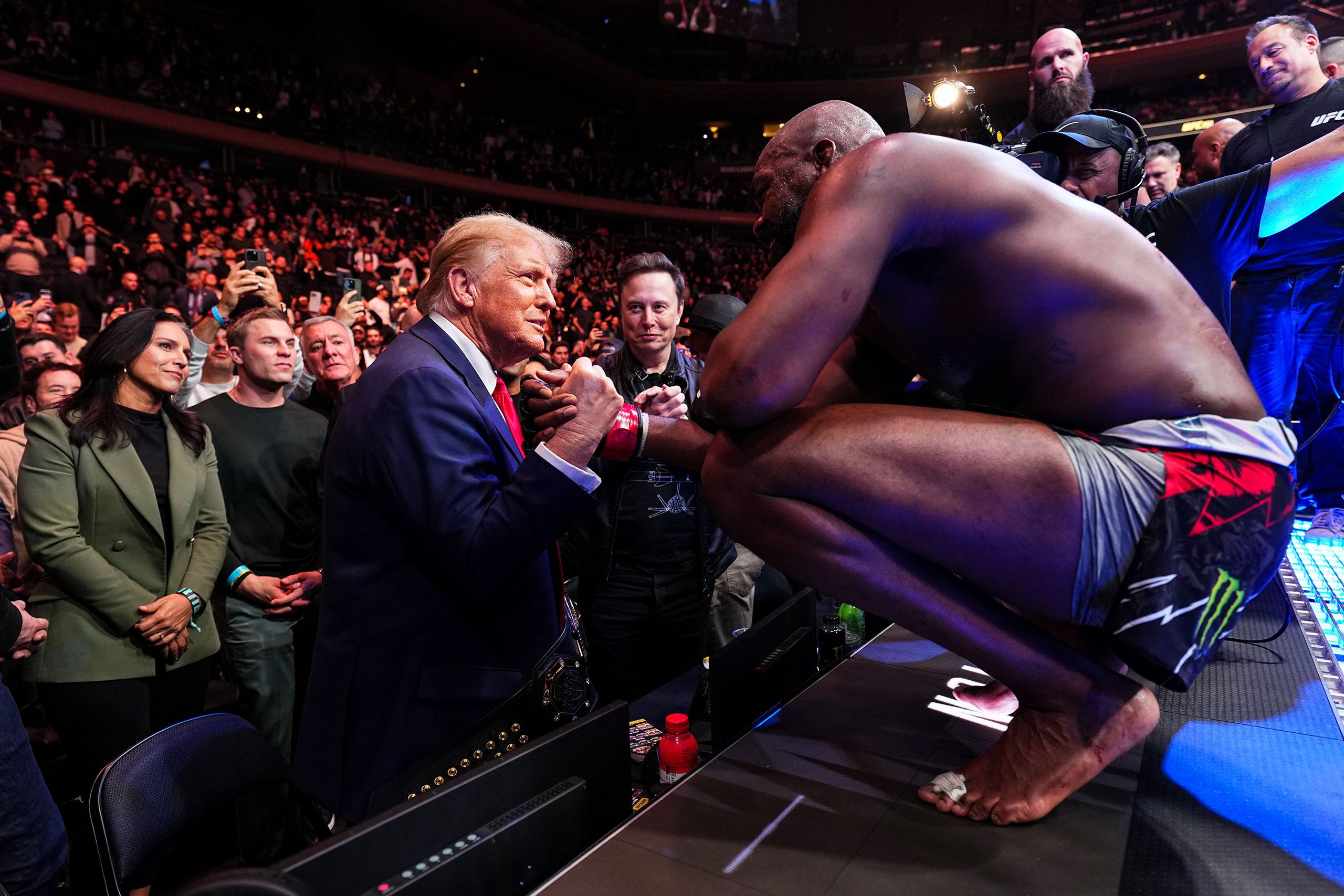 Donald Trump shakes hands with Jon Jones after his victory. Donald Trump shakes hands with Jon Jones after his victory.
