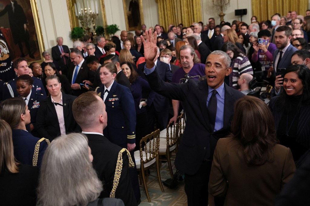 Former U.S. President Barack Obama greets guests after speaking about the Affordable Care Act and Medicaid at an event with U.S. President Joe Biden and Vice President Kamala Harris at the White House in Washington, U.S., April 5, 2022.  
