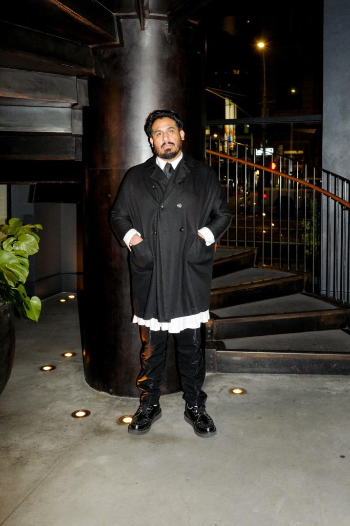 Ronny Estrella, a fashion designer and art curator by day, also runs the door at The Blond.