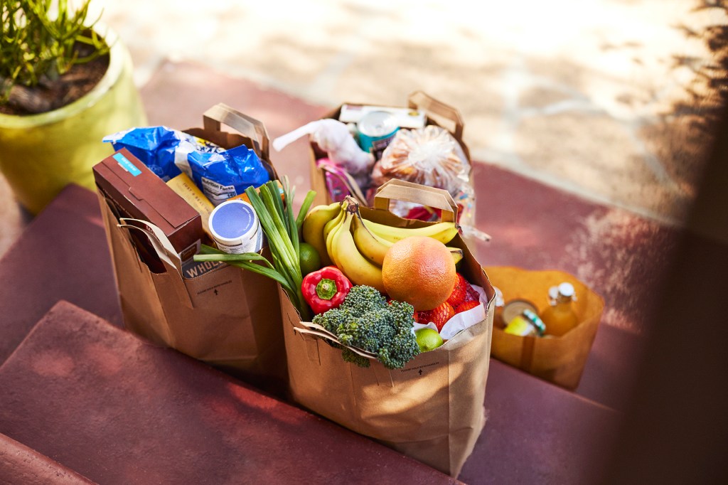 Bags of groceries on the front stoop