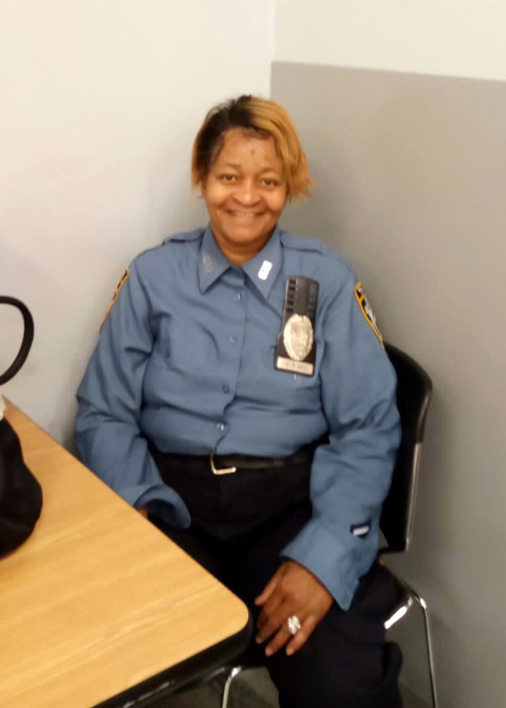 NYPD Traffic Agent Yvonne Llewellyn Campbell is pictured at a desk.