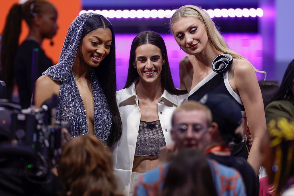 Angel Reese, Caitlin Clark, and Cameron Brink posing for a photo at the WNBA Draft in New York, 2024