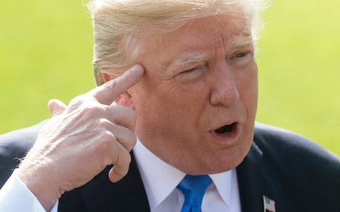 TRUMP-WITH-FINGER-TO-HEAD.jpg