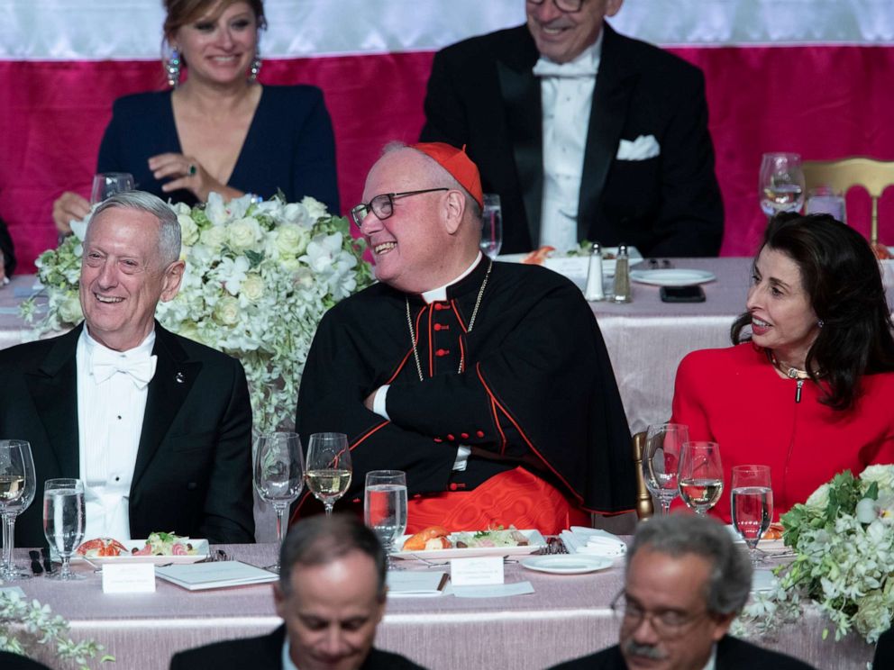 PHOTO: Former U.S. Secretary of Defense Jim Mattis, left, Cardinal Timothy Dolan, center, and Happy Warrior Award Recipient Mary Ann Tighe react to opening remarks during the 74th Annual Alfred E. Smith Dinner, Thursday, Oct. 17, 2019, in New York.