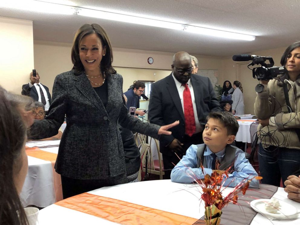 PHOTO: Democratic presidential candidate Sen. Kamala Harris, D-Calif., speaks to Aaron Nachampassak, 11, right and others at a church congregation breakfast in Fort Dodge, Iowa, on Nov. 10, 2019. 