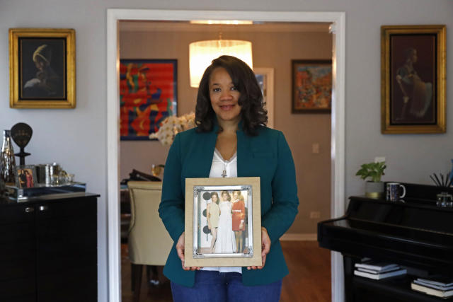 Robin Rue Simmons poses in her living room.