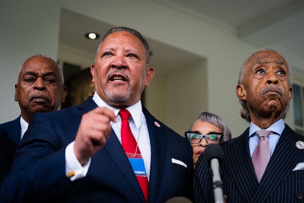 Marc Morial talking to off-camera press members and standing next to Al Sharpton.