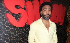 Childish Gambino at 'Swarm' premiere, wearing a yellow shirt and yellow pants.